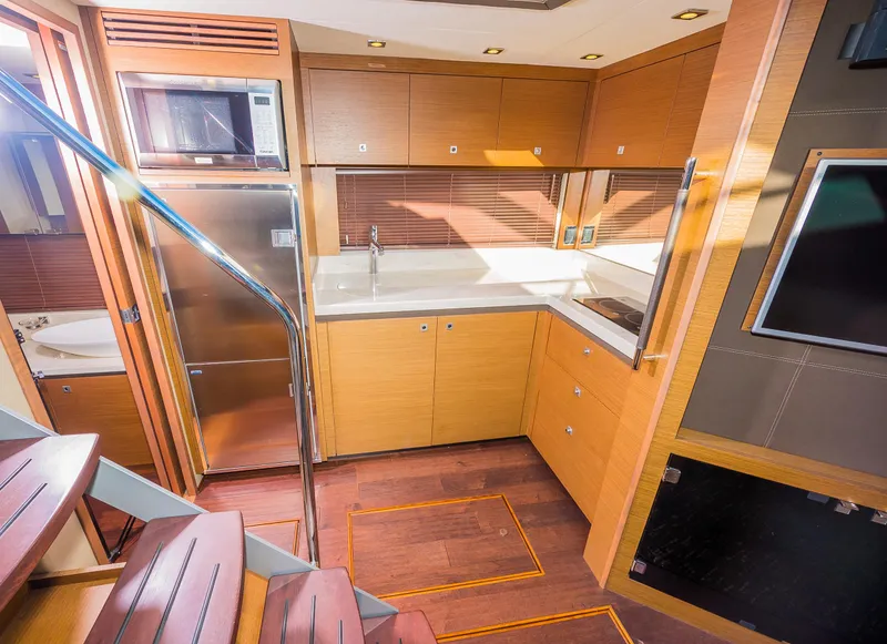 Slide: The Image of Modern kitchen area in 2015 Sea Ray Sundancer 510 yacht with stainless steel appliances. - 19