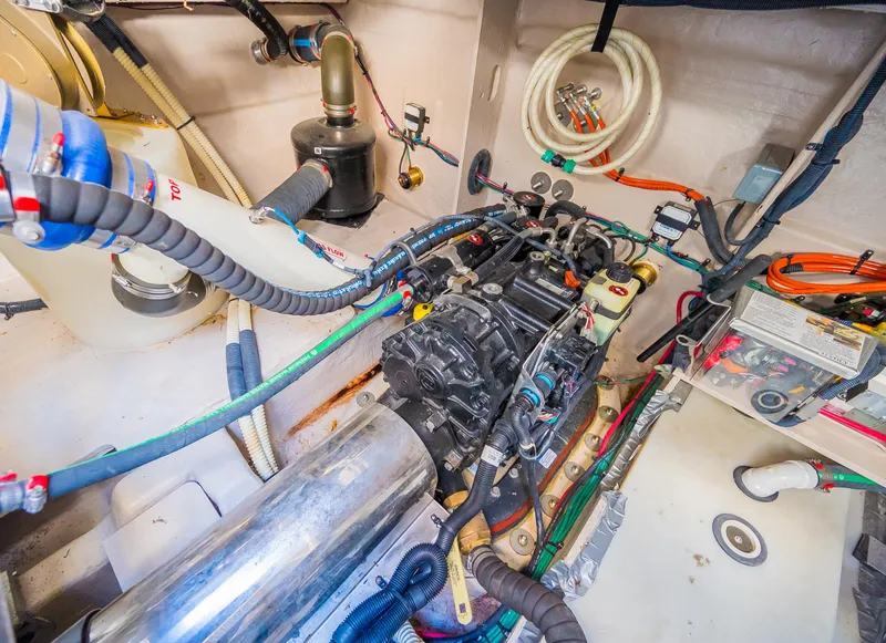 Slide: The Image of Engine compartment of a 2015 Sea Ray Sundancer 510 yacht with various mechanical components. - 21