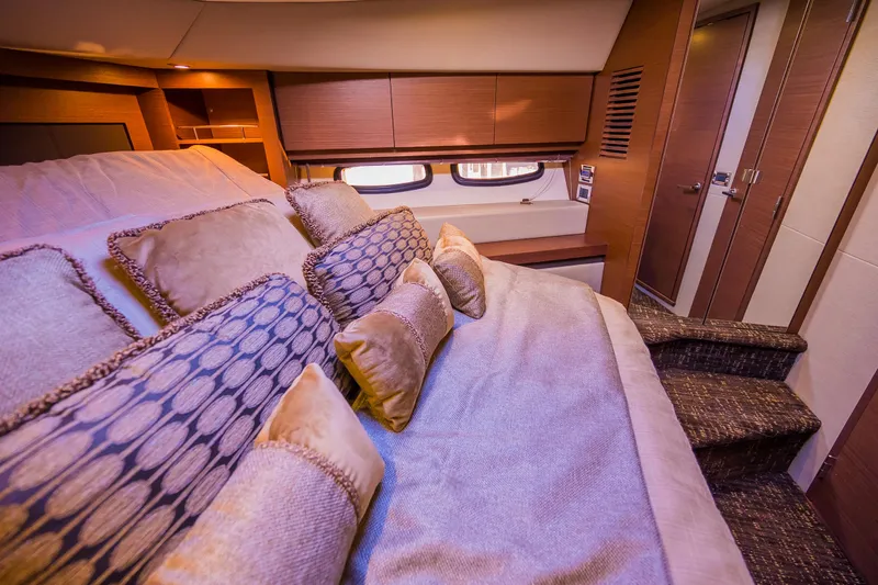 Slide: The Image of Luxurious bedroom interior of 2015 Sea Ray Sundancer 510 yacht with plush bedding. - 38