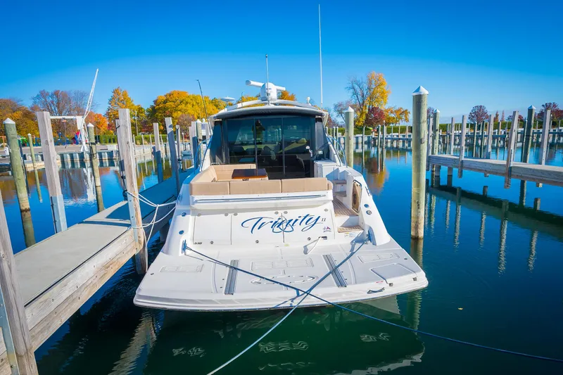 Slide: The Image of 2015 Sea Ray Sundancer 510 docked at a marina on a sunny day. - 4