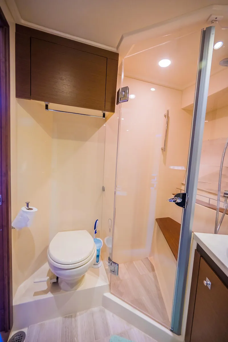 Slide: The Image of 2015 Sea Ray Sundancer 510 yacht bathroom with modern fixtures and glass shower. - 45