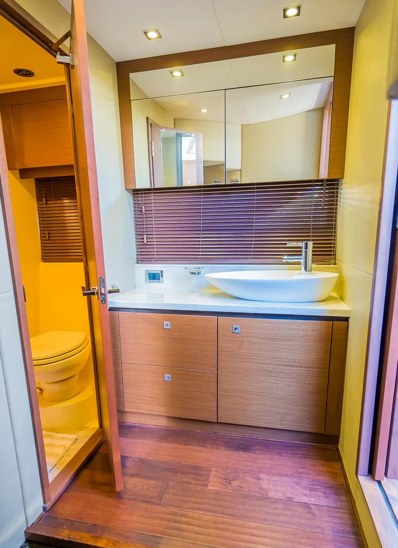 Slide: The Image of Modern bathroom in 2015 Sea Ray Sundancer 510 yacht with wooden cabinetry and vessel sink. - 46
