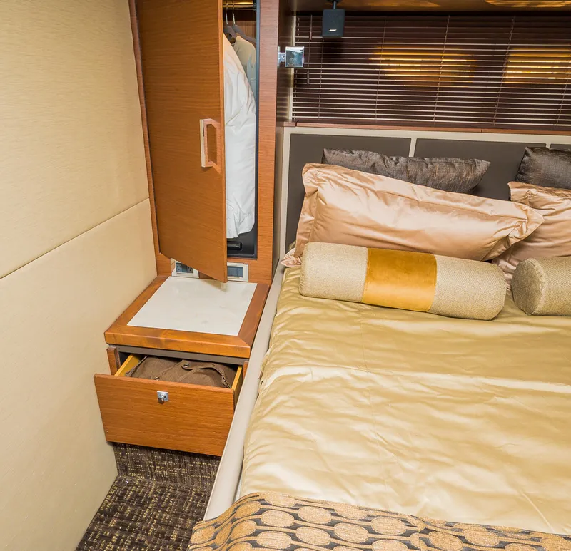 Slide: The Image of Luxurious bedroom interior of 2015 Sea Ray Sundancer 510 yacht with wooden wardrobe and cozy bedding. - 5