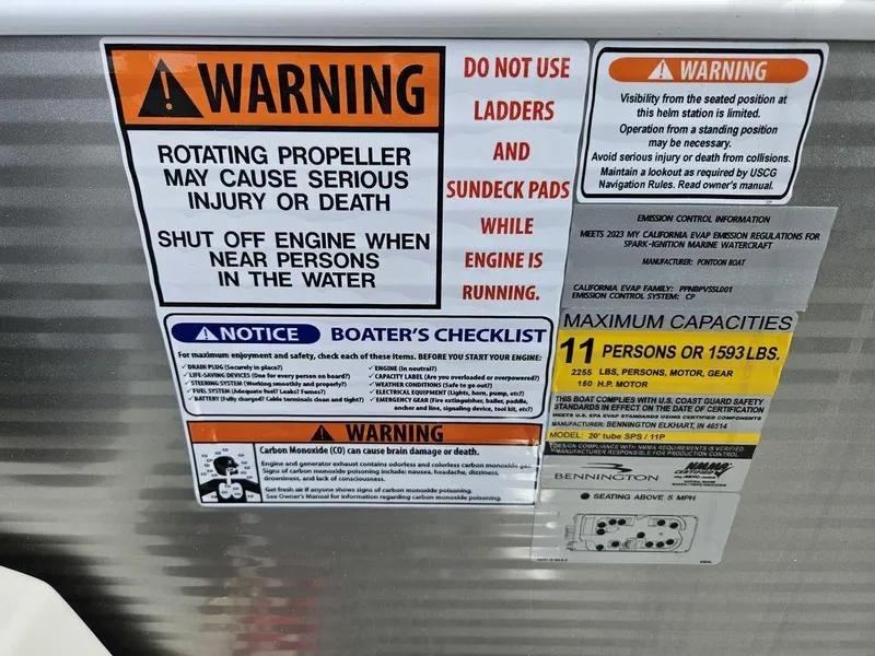 Slide: The Image of 2023 Bennington 21 SXL safety and capacity warning labels on boat. - 2