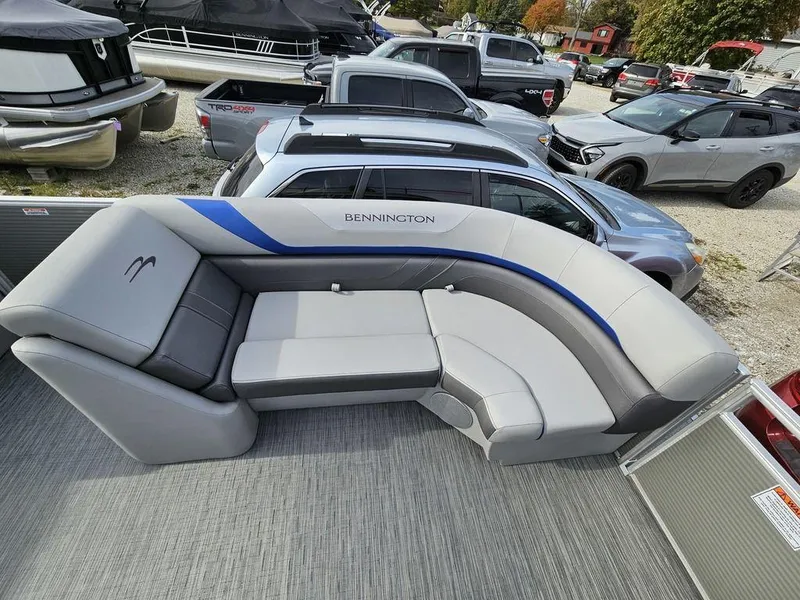 Slide: The Image of 2023 Bennington 21 SXL pontoon boat with luxurious seating and modern design. - 3