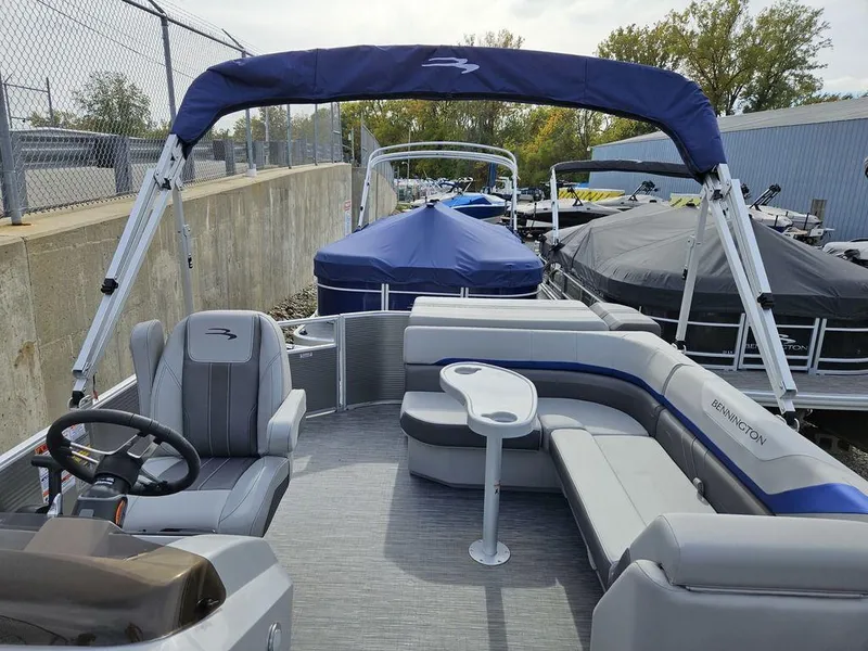 Slide: The Image of 2023 Bennington 21 SXL pontoon boat with seating and canopy. - 9