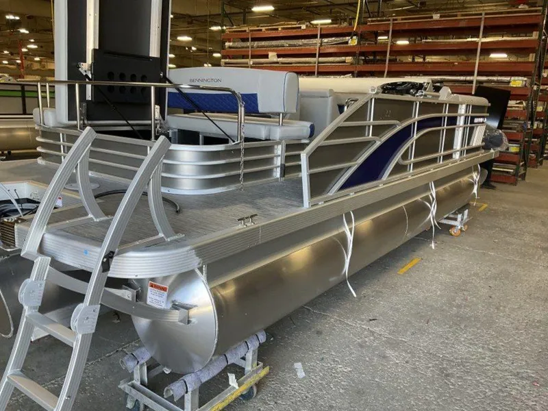 Slide: The Image of 2023 Bennington 22 LSB pontoon boat in a warehouse. - 14