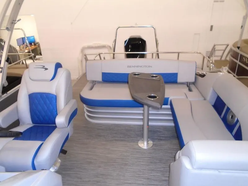 Slide: The Image of 2023 Bennington 22 LSB pontoon boat interior with blue and gray seating. - 15