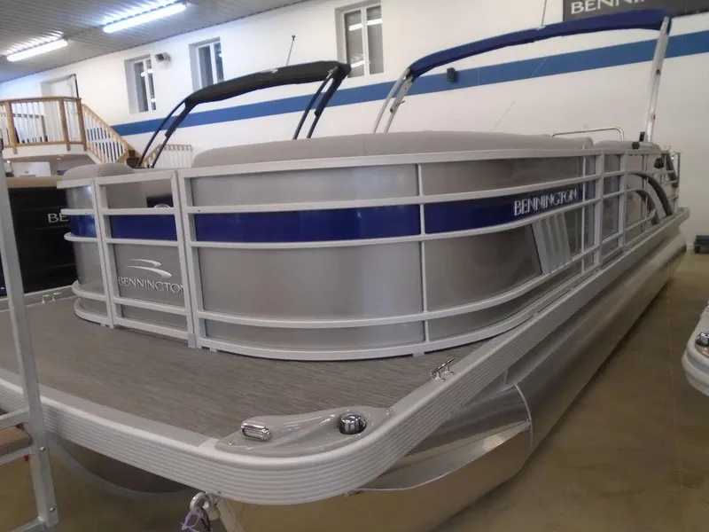 Slide: The Image of 2023 Bennington 22 LSB pontoon boat in showroom, side view. - 21