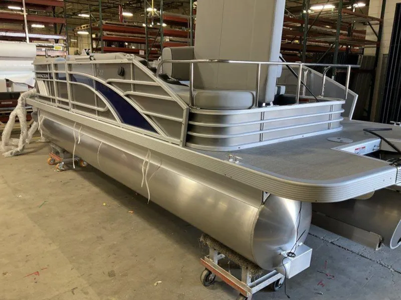 Slide: The Image of 2023 Bennington 22 LSB pontoon boat in a warehouse. - 25