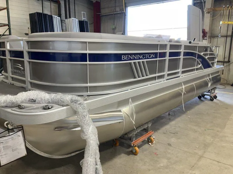 Slide: The Image of 2023 Bennington 22 LSB pontoon boat in a warehouse. - 26