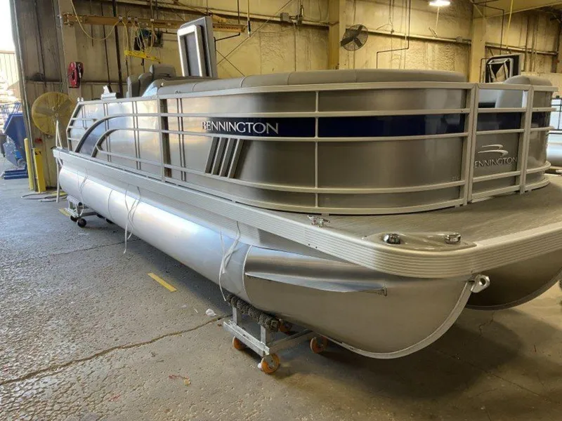 Slide: The Image of 2023 Bennington 22 LSB pontoon boat in a warehouse. - 8