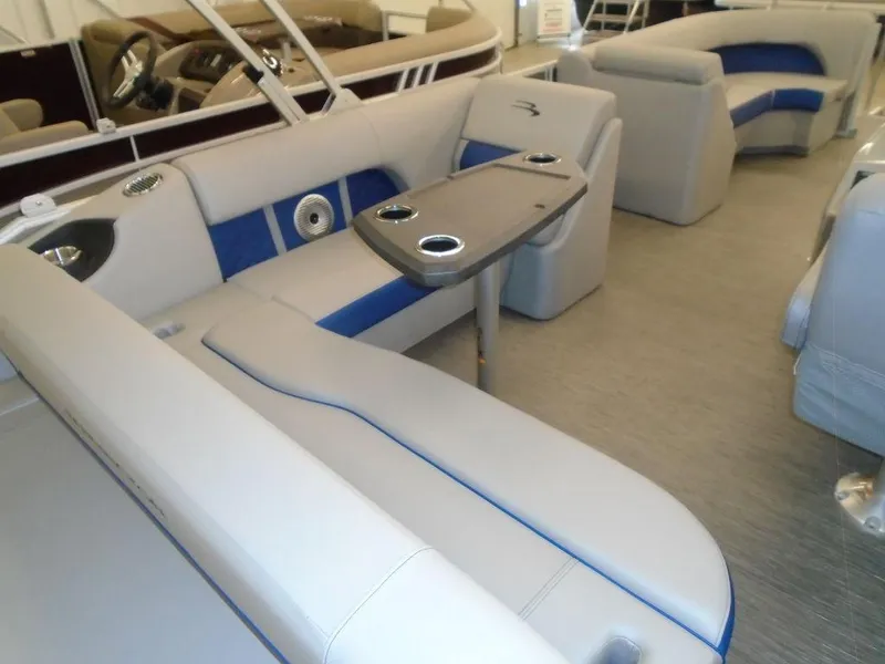 Slide: The Image of 2023 Bennington 22 LSB pontoon boat interior with gray and blue seating. - 9