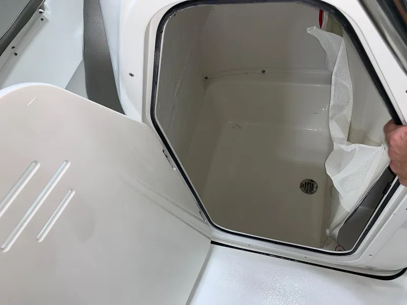 Slide: The Image of 2024 Key West 189 FS storage compartment with open hatch. - 7
