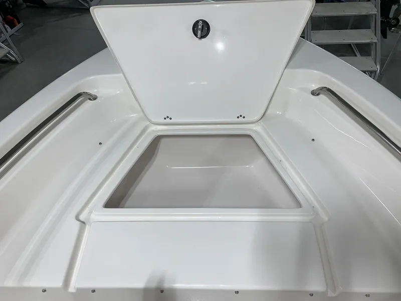 Slide: The Image of 2024 Key West 189 FS boat bow storage compartment with open hatch. - 12