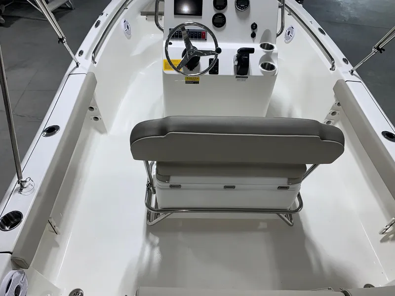 Slide: The Image of 2024 Key West 189 FS boat interior with steering console and seating. - 3