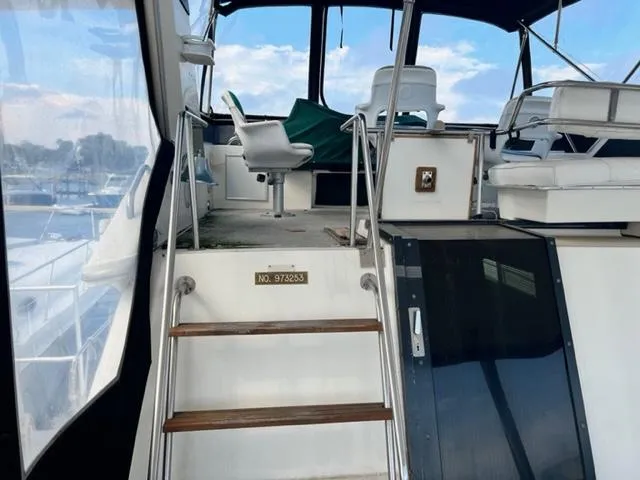 Slide: The Image of 1990 Sea Ray 380 Aft Cabin yacht interior with steps leading to the upper deck. - 7
