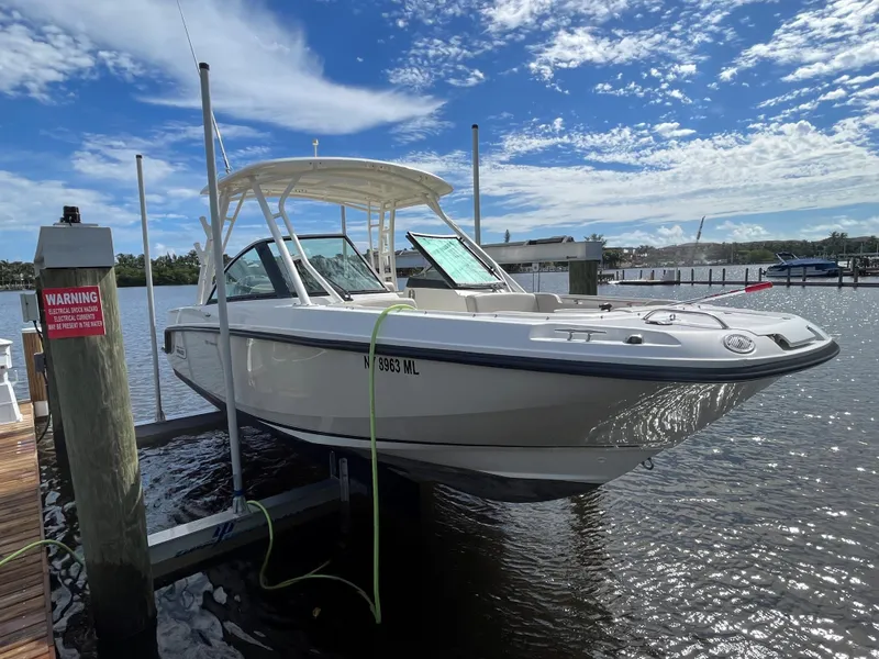The Image of 2016 Boston Whaler 230 Vantage boat docked at a marina. - 0