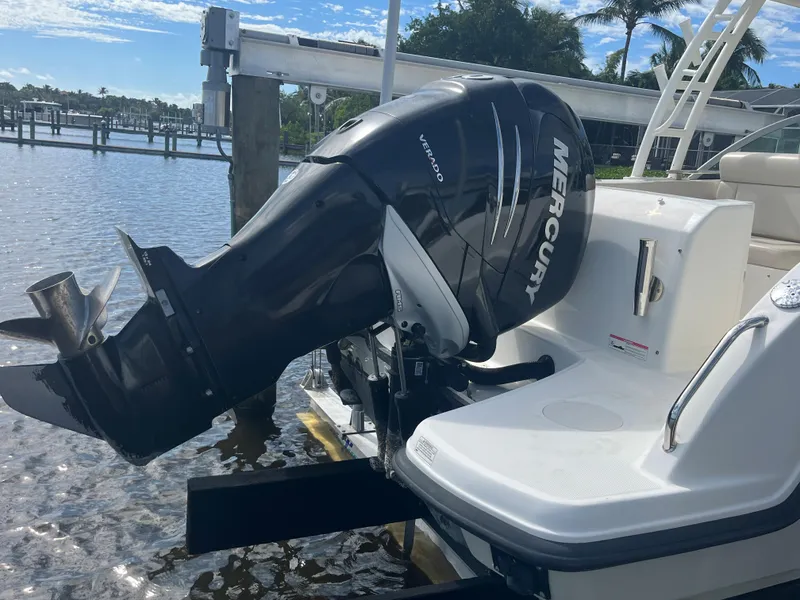 Slide: The Image of 2016 Boston Whaler 230 Vantage with Mercury outboard motor at dock. - 23