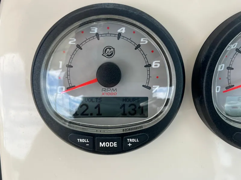 Slide: The Image of Close-up of 2016 Boston Whaler 230 Vantage RPM gauge showing 2.1 volts and 131 hours. - 27