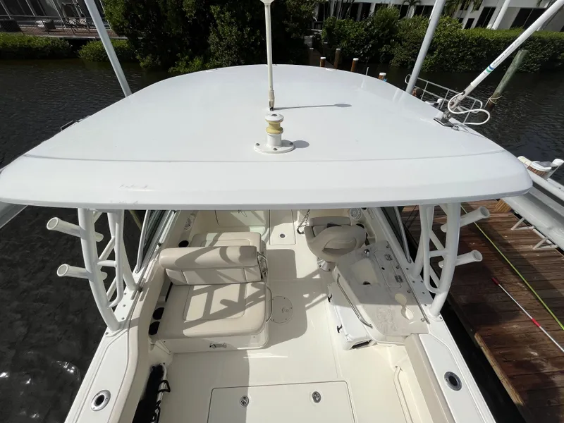 Slide: The Image of 2016 Boston Whaler 230 Vantage boat interior with seating and helm station. - 4