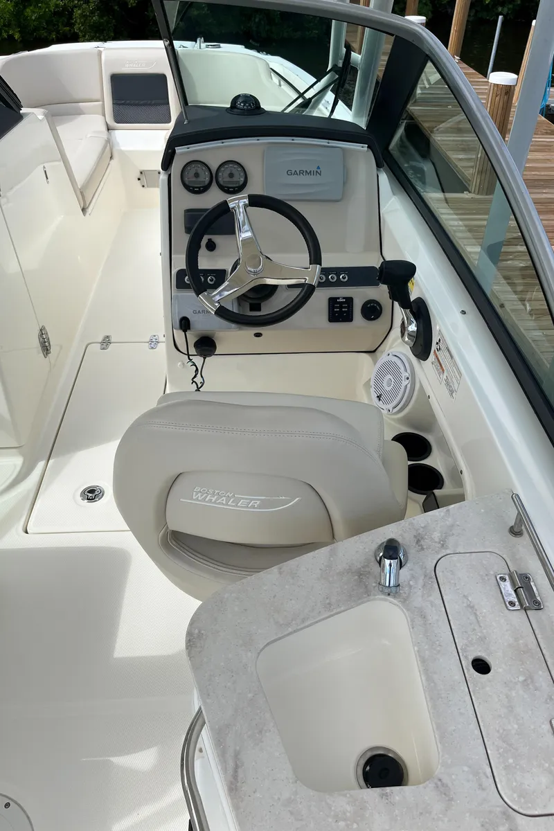 Slide: The Image of 2016 Boston Whaler 230 Vantage boat cockpit and helm station. - 6