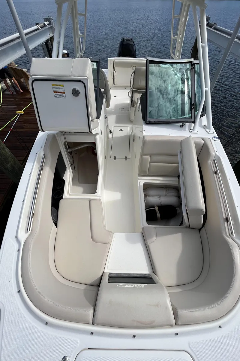 Slide: The Image of 2016 Boston Whaler 230 Vantage boat interior with seating and storage compartments. - 8
