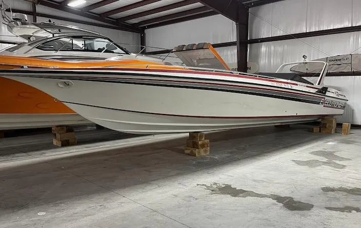 Slide: The Image of 1989 Fountain 12m speedboat in indoor storage. - 1