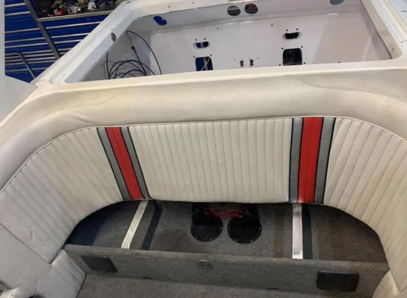 Slide: The Image of 1989 Fountain 12m boat interior with white, red, and black upholstery. - 3