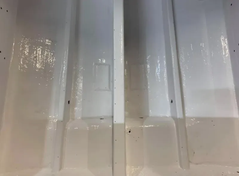 Slide: The Image of Close-up of the hull of a 1989 Fountain 12m boat. - 5