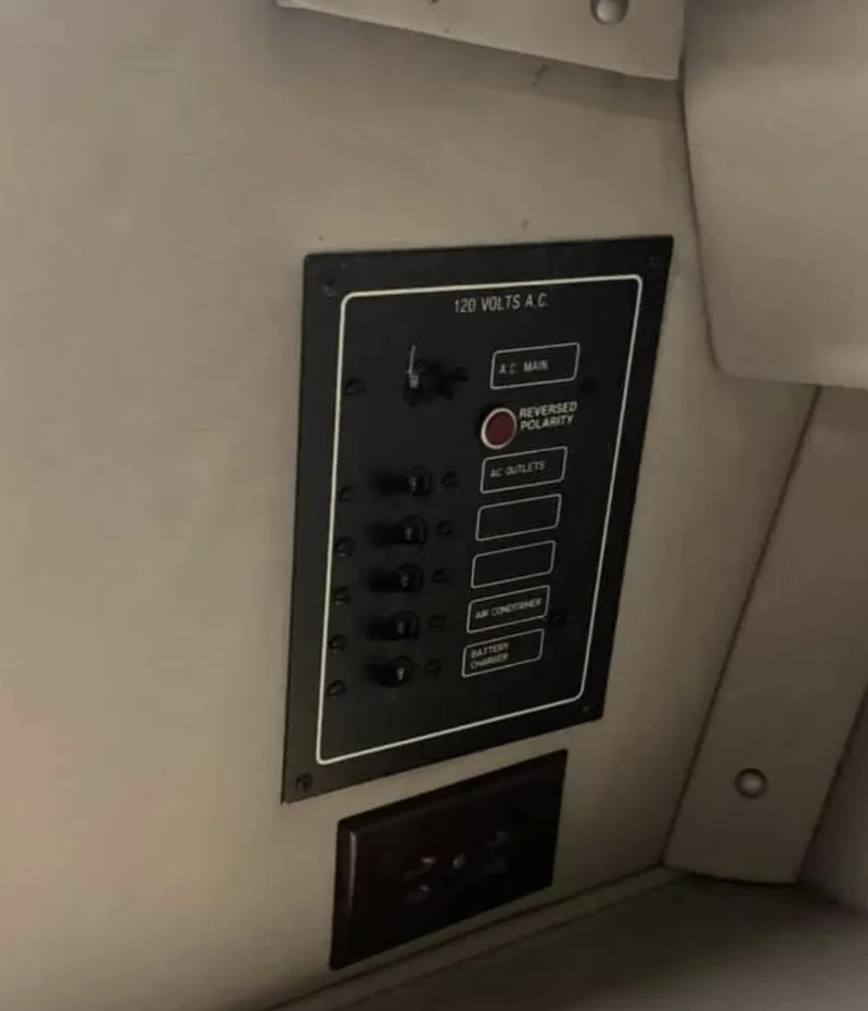 Slide: The Image of Control panel of a 1989 Fountain 12m boat with various switches and indicators. - 9