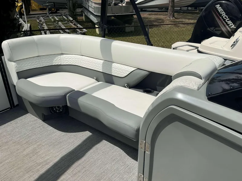 Slide: The Image of Luxurious seating on 2023 MONACO 235 DFL boat, featuring elegant white and gray upholstery. - 9