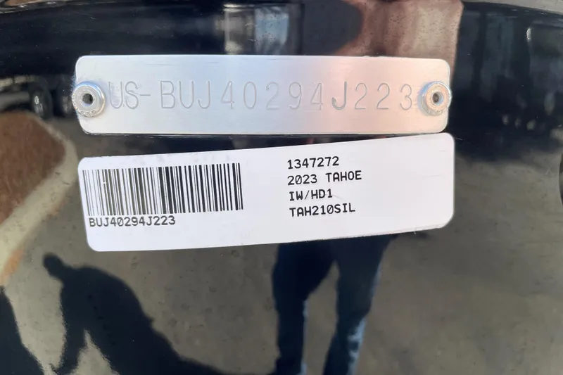 Slide: The Image of 2023 Tahoe 210 Si Limited identification plate with serial number and barcode. - 12