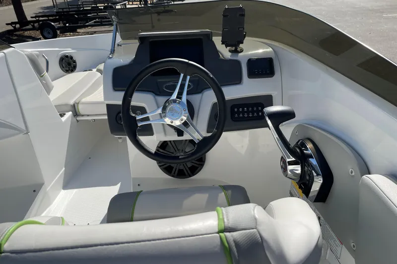 Slide: The Image of 2023 Tahoe 210 Si Limited boat interior with steering wheel and control panel. - 5