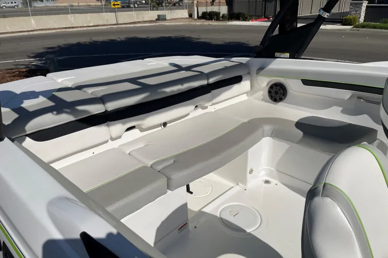 Slide: The Image of 2023 Tahoe 210 Si Limited boat interior with gray seating and speaker. - 6