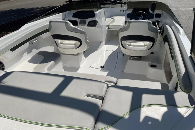 Slide: The Image of 2023 Tahoe 210 Si Limited boat interior with modern seating and steering console. - 7