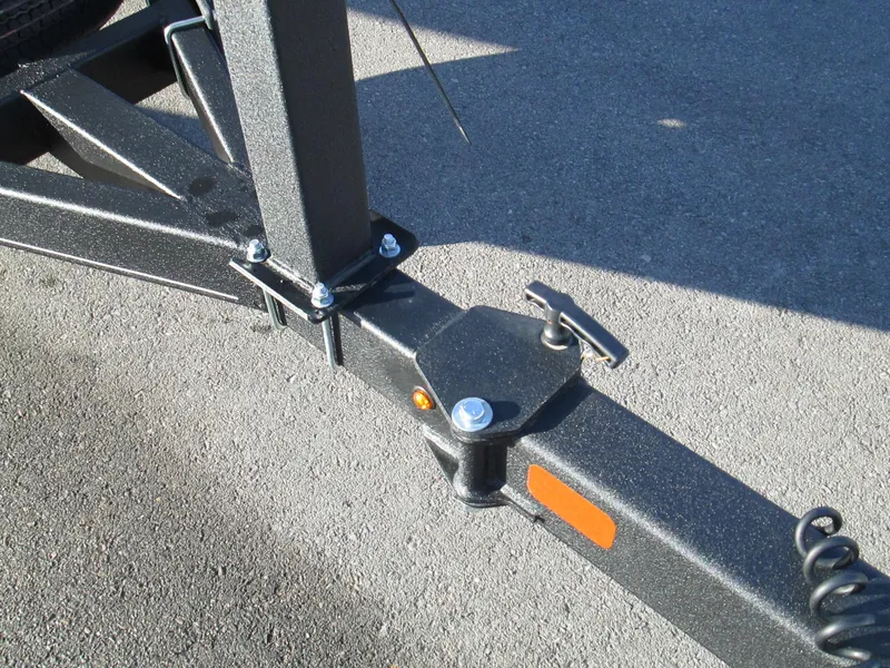 Slide: The Image of Close-up of 2023 Tahoe 210 Si Limited trailer hitch on asphalt. - 14