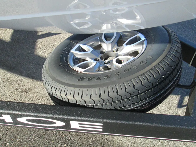 Slide: The Image of Spare tire of a 2023 Tahoe 210 Si Limited boat trailer. - 15