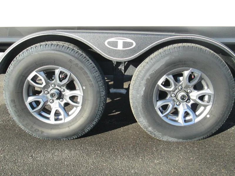 Slide: The Image of 2023 Tahoe 210 Si Limited trailer wheels and tires. - 16