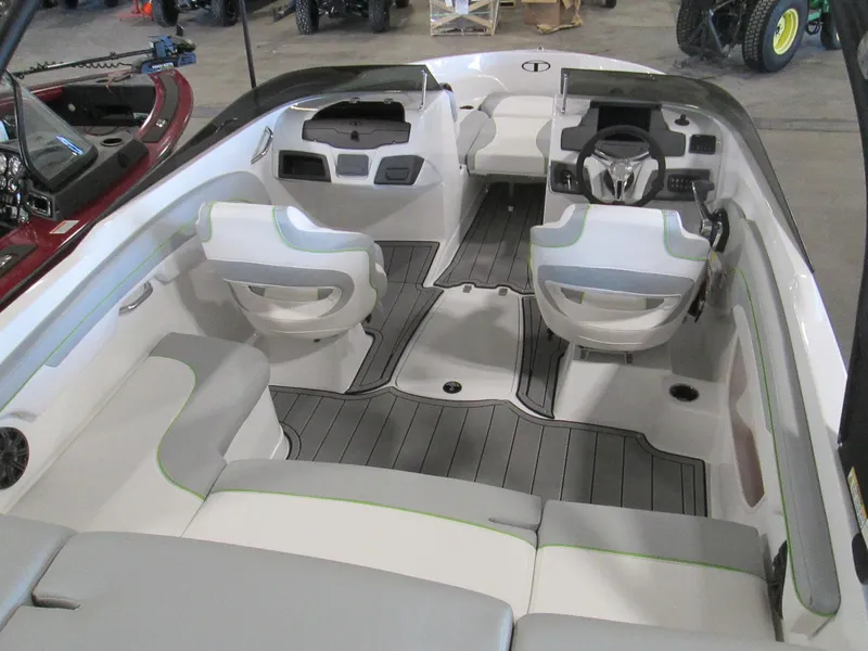 Slide: The Image of 2023 Tahoe 210 Si Limited boat interior with modern seating and dashboard. - 19