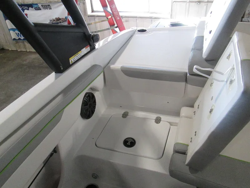 Slide: The Image of 2023 Tahoe 210 Si Limited boat interior with seating and storage compartments. - 21