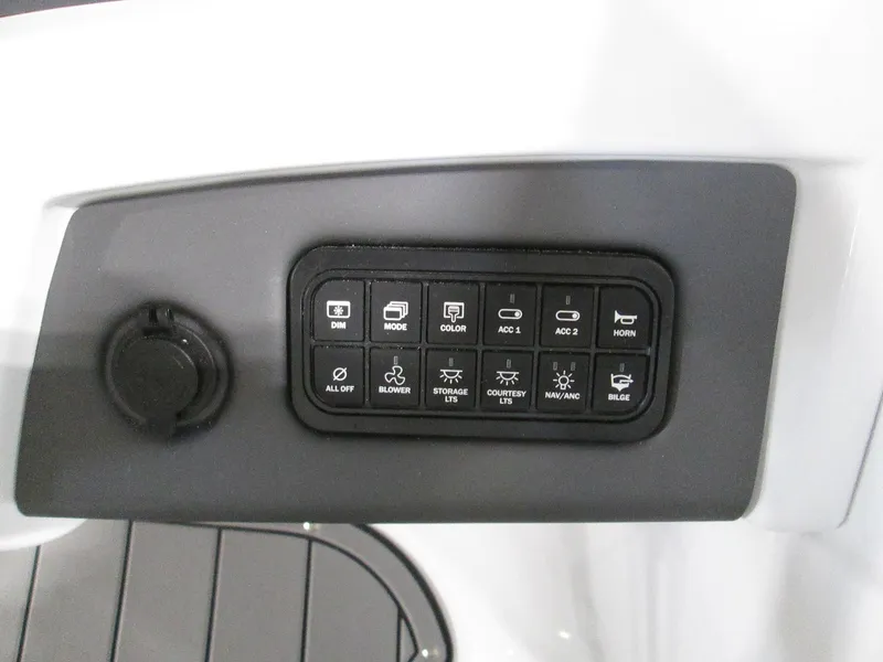 Slide: The Image of Control panel of 2023 Tahoe 210 Si Limited boat with various function buttons. - 23