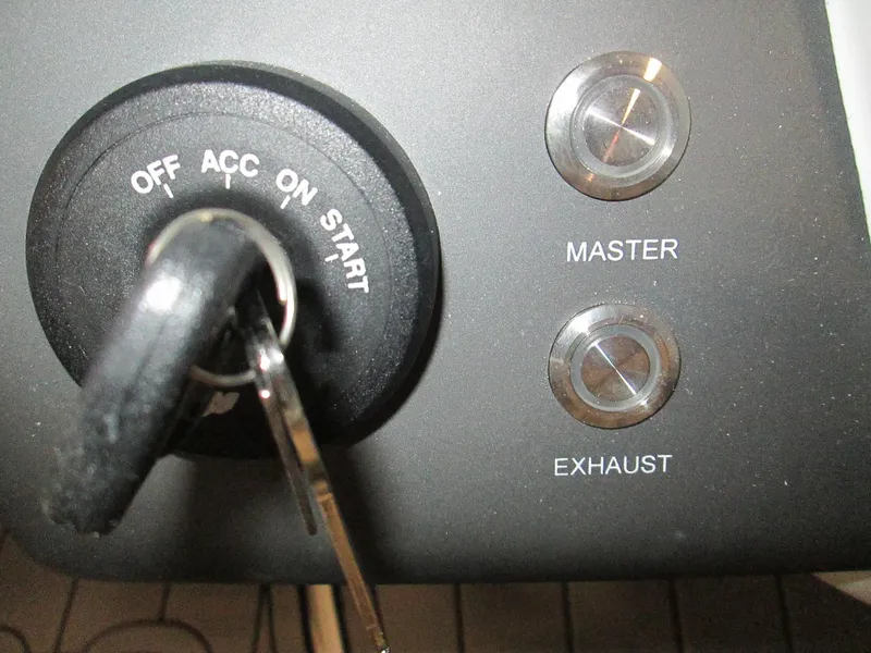 Slide: The Image of Ignition switch and control buttons of 2023 Tahoe 210 Si Limited boat. - 26