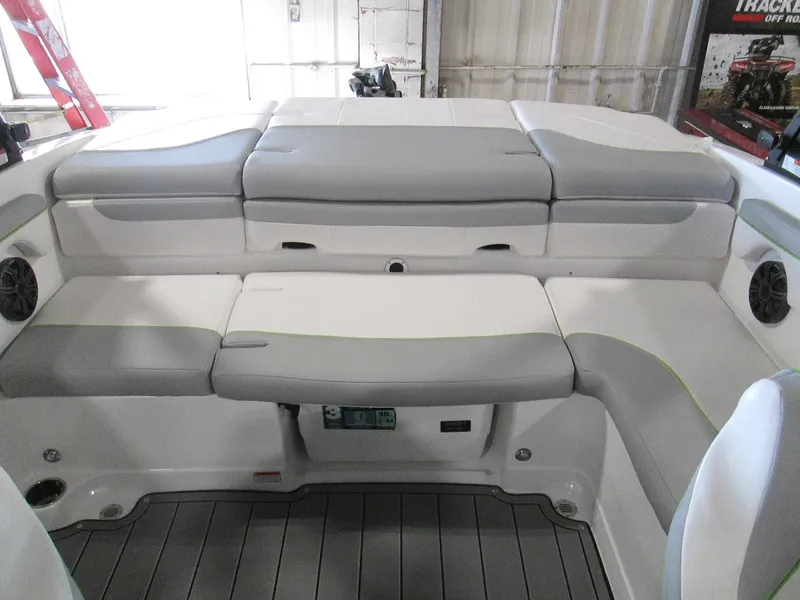 Slide: The Image of 2023 Tahoe 210 Si Limited boat interior with gray and white seating. - 30