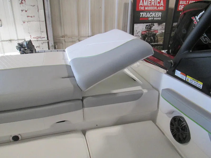 Slide: The Image of 2023 Tahoe 210 Si Limited boat interior with adjustable seating and speaker. - 31