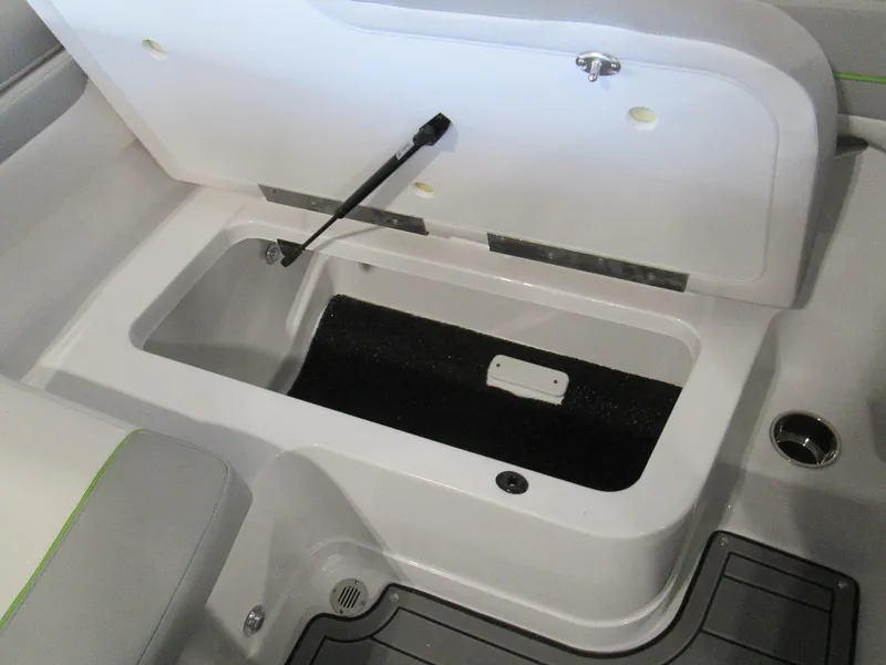Slide: The Image of 2023 Tahoe 210 Si Limited boat storage compartment with open lid. - 32