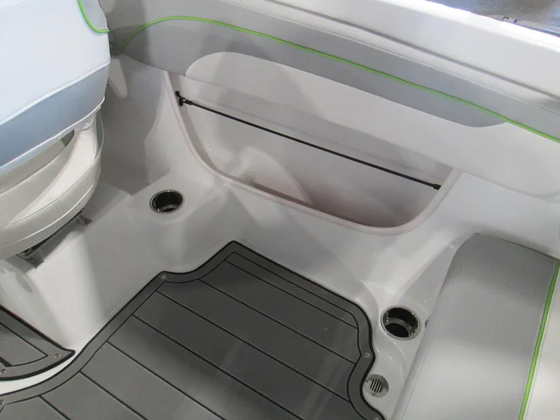 Slide: The Image of 2023 Tahoe 210 Si Limited boat interior with gray flooring and green accents. - 35