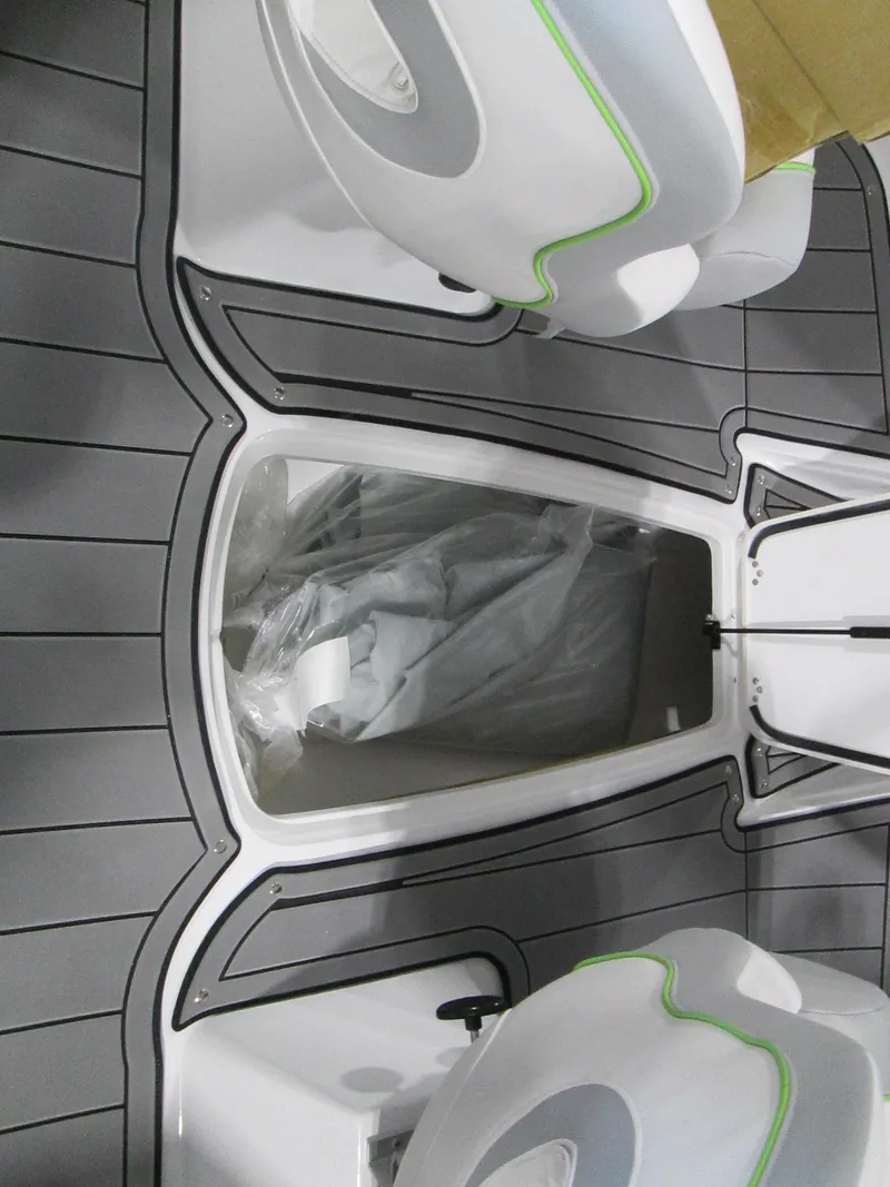 Slide: The Image of 2023 Tahoe 210 Si Limited boat interior with storage compartment and seating. - 37