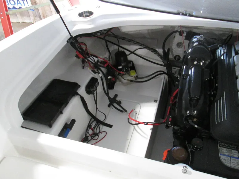 Slide: The Image of 2023 Tahoe 210 Si Limited boat engine compartment with wiring and components. - 46