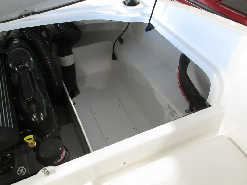Slide: The Image of 2023 Tahoe 210 Si Limited boat engine compartment with storage space. - 47